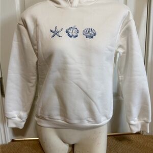 White Hoodie with Blue Seashell Design